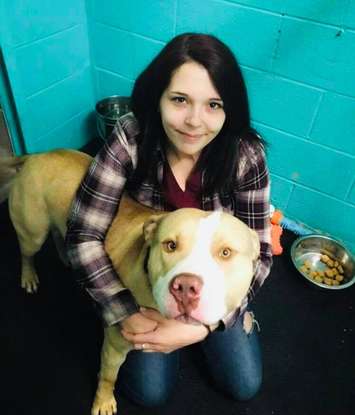 Shai Jefferson and Zeus at SHAID Tree Animal Shelter in Nova Scotia before he was adopted (Photo via SHAID Tree Animal Hospital Facebook) 