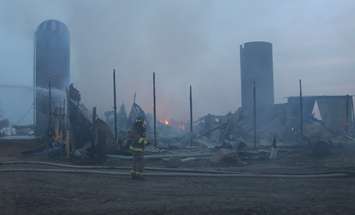 Area fire departments battle blaze at dairy farm in Tecumseh, April 18, 2016. (Photo by Maureen Revait) 