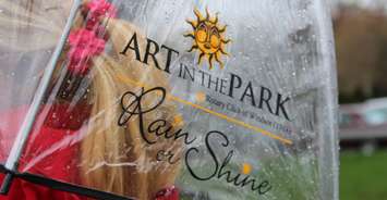 'Art in the Park Rain or Shine' part of the new marketing campaign for the 38th annual festival, April 28, 2016. (Photo by Maureen Revait) 
