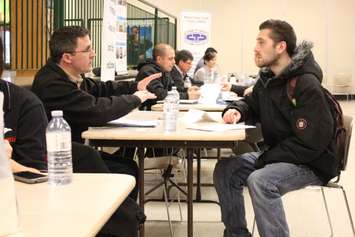 St. Clair College Industrial Mechanics students sit down with employers during a skilled trades job fair at the schools main campus, February 18, 2015. (Photo by Mike Vlasveld)
