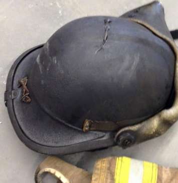 A helmet worn by a London firefighter that is nearly melted after a fire on Clarence St. in London, February 7, 2015. (Photo courtesy of the London Professional Fire Fighters Association via Facebook)