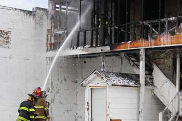 Firefighters at the scene of an apartment fire at the corner of Wyandotte St. E and Gladstone Ave. in Windsor, May 20, 2017.  (Photo by Adelle Loiselle)