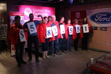 Unifor Local 200 United Way "superhero" canvassers unveil the total donation from 2014, January 9, 2015. (photo by Mike Vlasveld)