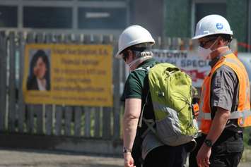 An official from the Ministry of the Environment arrives at the scene of a fire on Wyandotte St. E in Windsor, May 23, 2016.  (Photo by Adelle Loiselle)