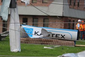 Crews assess and clean up the damage left near the EC Row Expressway and Central Avenue in Windsor on August 25, 2016 after a tornado hit the area. (Photo by Ricardo Veneza)