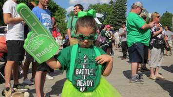 A little girl dressed in green waiting to greet the Knights in Victoria Park, May 30, 2016. Photo by Miranda Chant, Blackburn News.