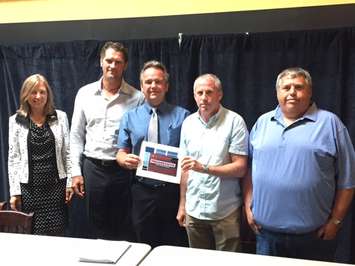 Members of Sarnia City Council, the Sarnia Sting, Progressive Auto Sales and the City of Sarnia gather at Legends Restaurant to reveal the design for the new Progressive Auto Sales Arena logo. August 15, 2016 BlackburnNews.com photo by Melanie Irwin