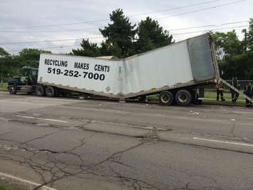 A transport carrying recycled paper collapses on Wyandotte St. E, June 12. 2015. (Photo by Jason Viau)