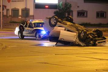 One vehicle flipped following a collision at the intersection of Howard Ave. and Tecumseh Rd. E, May 19, 2015. (Photo by Jason Viau)