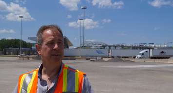 Federal Bridge Corporation Limited Director of Communications Todd Kealey with Blue Water Bridge in the backgroud. June 11. 2019. (BlackburnNews photo by Colin Gowdy)