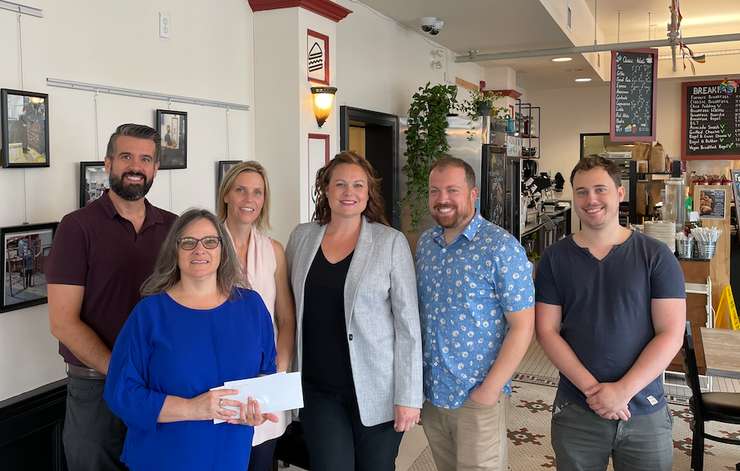 July donation cheque presentation from LHBA and The Tricar Group to Youth Opportunities Unlimited, Joan’s Place. Jeff White, Kathleen Barnard, Jen Grozelle, Amanda Moss, Jared Zaifman, Timo Climans (Image courtesy of the London Home Builders' Association)