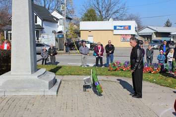 Pausing and reflecting at the Thamesville Remembrance service . Nov. 11, 2015. (Photo by Simon Crouch) 