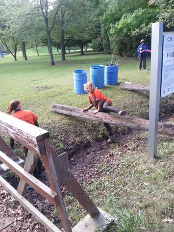 Participants tackle the Grapes of Wrath obstacle course at CM Wilson Conservation Area in Blenheim, September 12, 2015. (Photo by Cheryl Johnstone)