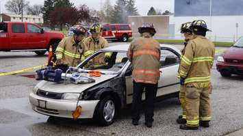 Firefighters show students how power the Jaws Of Life can be. (Photo by Jake Jeffrey)