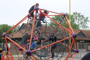 Students, parents and teachers enjoy a sneak preview of the Farrow Riverside Miracle Park in Windsor, May 24, 2019. Photo by Mark Brown/Blackburn News.