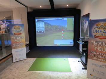 The golf simulator inside the Dream Home at 2162 Ironwood Rd. (Photo by Miranda Chant, Blackburn News)