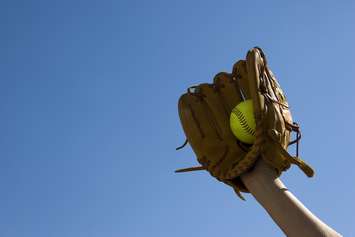 Softball with blue sky. © Can Stock Photo / rbouwman