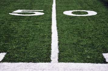Football 50-yard-line  (© Can Stock Photo / purple_dragon)