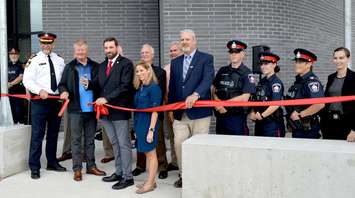 Saugeen Shores Mayor Luke Charbonneau [3rd from left] cuts the ribbon to officially open the new Saugeen Shores Police Service building. September 25th, 2019 (Photo by Jordan Mackinnon)