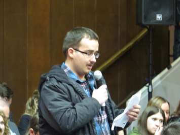 21-year-old Zack questions the federal deficit at the Prime Minister's town hall at Western University, January 13, 2017. (Photo by Miranda Chant, Blackburn News)
