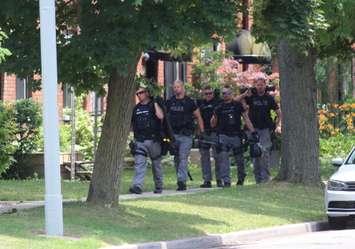 Windsor police investigating a shooting at Wyandotte St. E near Walker Rd. June 22, 2016. (Photo by Maureen Revait)