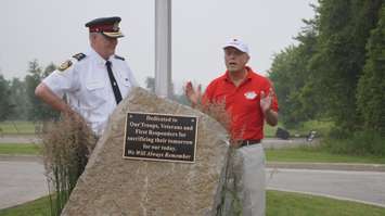 Global Donuts on London Line officially raised the Canadian flag and unveiled a memorial plaque Tuesday. June 30, 2015 (BlackburnNews.com Photo by Briana Carnegie)