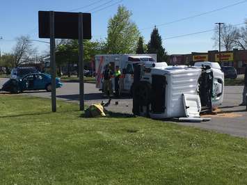 A vehicle flipped on its side in a crash on Lambton Mall Rd. May 19, 2016 (BlackburnNews.com photo by Briana Carnegie)
