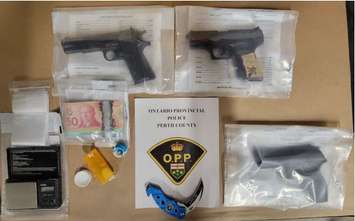 Drugs, weapons, and cash seized by the OPP in a raid in Listowel. Photo supplied by the OPP. 
