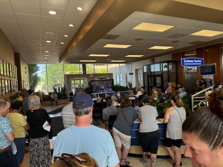 An overflow crowd watches the Indwell meeting from the lobby at Sarnia City Hall. August 11, 2025 Blackburn Media photo by Melanie Irwin.