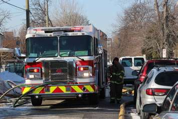 Firefighters at the scene of two house fires in the 800-block of Assumption St. in Windsor March 2, 2015. (Photo by Adelle Loiselle.)