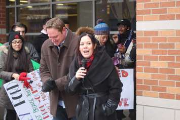 Windsor West MPP Lisa Gretzky speaks as Essex MPP Taras Natyshak listens at a rally at the University of Windsor, January 24, 2019. Photo by Mark Brown/Blackburn News.