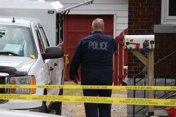 Police and fire officials investigate a fatal fire on Aubin Rd., August 12, 2015. (Photo by Jason Viau)