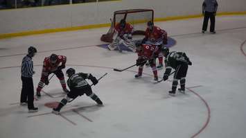 Faceoff to the right of Sarnia goalie Jorgen Johnson. (photo by Jake Jeffrey)