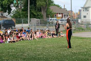 Vollans tells students the history of rope tricks while standing inside her own lasso. June 12, 2018 (Photo by Greg Higgins)