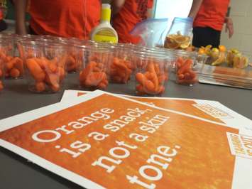 Grade 11 and 12 students at Ursuline College in Chatham set up a booth with games and prizes focused on sharing information on the dangers of tanning on June 2, 2016. (Photo by Ricardo Veneza)