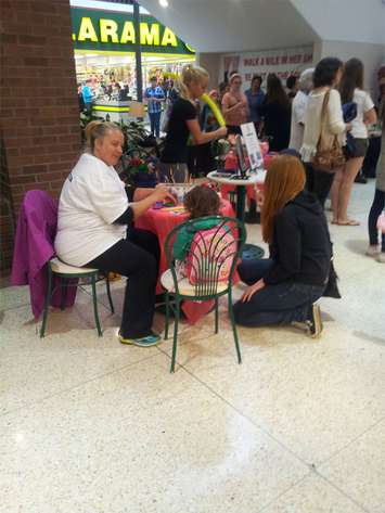 Local residents attend Chatham-Kent's Walk a Mile In Her Shoes event at the Downtown Chatham Centre, May 31, 2015. (Photo by the Blackburn Radio Summer Patrol)