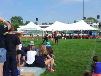 Local residents participate in Relay for Life 2015 at Chatham Kent Secondary School, June 13, 2015. (Photo by the Blackburn Radio Summer Patrol)