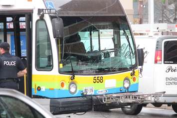 A car and a Transit Windsor bus collide at the intersection of Erie and Goyeau, August 10, 2015. (Photo by Jason Viau)