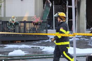 A firefighter at the scene of a fire at a restaurant at Wyandotte St. E and Marion Ave. in Windsor, October 12, 2015.  (Photo by Adelle Loiselle)