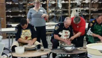 Local politicians, police and other community members work on pottery at Lambton College. January 12, 2015 (BlackburnNews.com photo by Jake Jeffrey)
