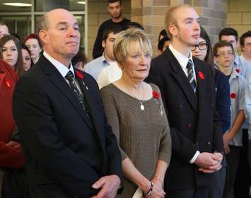 The parents and brother of Cpl. Andrew Grenon attend a ceremony at St. Joseph's High School, Novermber 11, 2014. (photo by Mike Vlasveld)