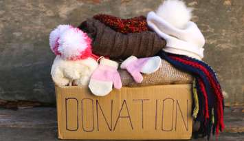 Donation box with warm winter clothes. Photo by Mukhina1 / iStock / Getty Images Plus via Getty Images