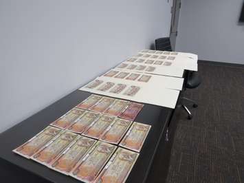 Counterfeit $100 bills seized by London police. (Photo by Miranda Chant, Blackburn News)