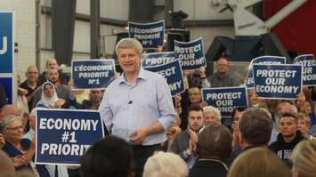 Party faithful including retired MP Pat Davidson look on at Harper rally at LamSar Sept. 20, 2015 (BlackburnNews.com photo by Dave Dentinger)
