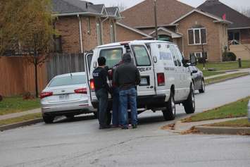 Windsor police ESU surround house in east Windsor to serve an outstanding arrest warrant, December 1, 2015. (Photo by Maureen Revait) 
