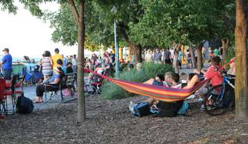 People getting comfortable along the Windsor waterfront prior to the 2016 Ford Fireworks, June 27, 2016. (Photo by Maureen Revait) 