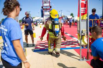 A Lambton College fire student drags a weighted manikin across the finish line at the 2023 Canadian FireFit National and World Championships. Image courtesy of Lambton College.