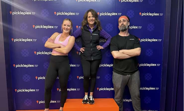 Gina Facca, Chief Operating Officer of Pickleplex Social Club, stands between Mix 96.7 morning show hosts Tori and Jay at the media day event for the Canadian National Pickleball League Western Split