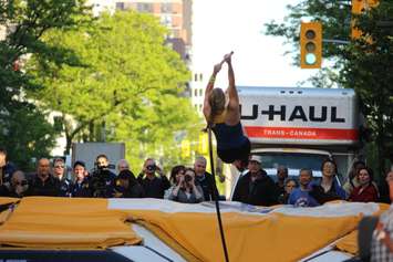 Athletes compete in a pole vaulting competition on Ouellette Ave., May 22, 2015. (Photo by Jason Viau)