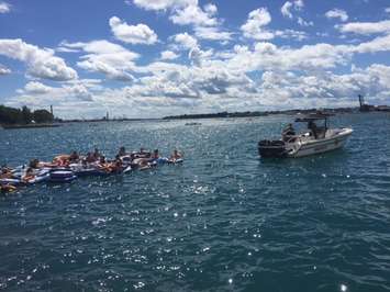 Participants in the Pt. Huron float down are pulled back to U.S. waters after being blown into Sarnia Bay. August 21, 2016 BlackburnNews.com photo by Melanie Irwin.
